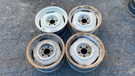 Four matching white 15x6.5-inch Mopar Stock Steel Wheels 5x4.5 inch