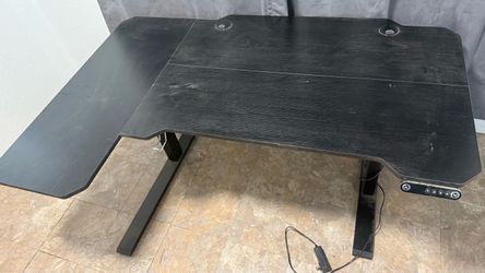 L-Shaped desk with high back office chair