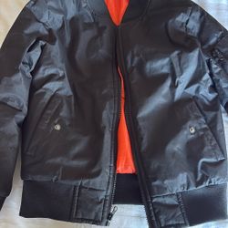 black bomber jacket with orange lining