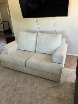 Comfortable light gray loveseat