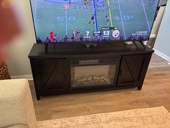 Black entertainment console with Heated Fireplace