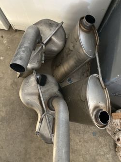 2 Mufflers and 2 resanators for a 2016 Dodge Charger RT
