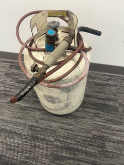 Propane tank with torch
