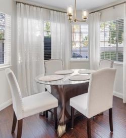 Round Glass Top Dining Table with 4 Upholstered Chairs