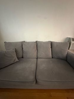 Gray Couch with two Pillows