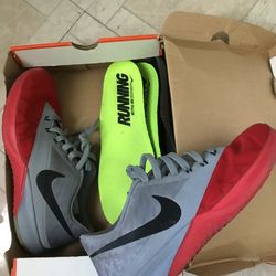Red and grey Nike shoes size 10
