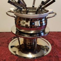 13 pc., 1.5 qt. Gourmet Ceramic and Acier Inoxydable Fondue Pot Set.  Fondue is a communal Swiss dish of melted cheese, meats or chocolates or use you