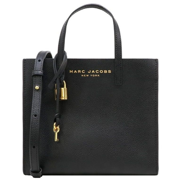 Elevate your style with this gorgeous Marc Jacobs Mini Grind crossbody bag. Crafted from high-quality black leather, this bag is perfect for any occas