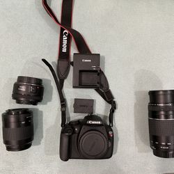 Canon EOS Rebel T5 18.0 MP DSLR Camera with 50 mm, 80-200 mm And 75-300 mm Lens.