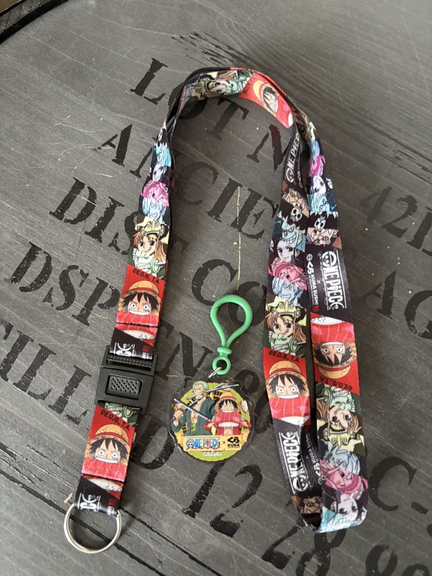 One Piece x Kura Revolving Sushi keychain and lanyard