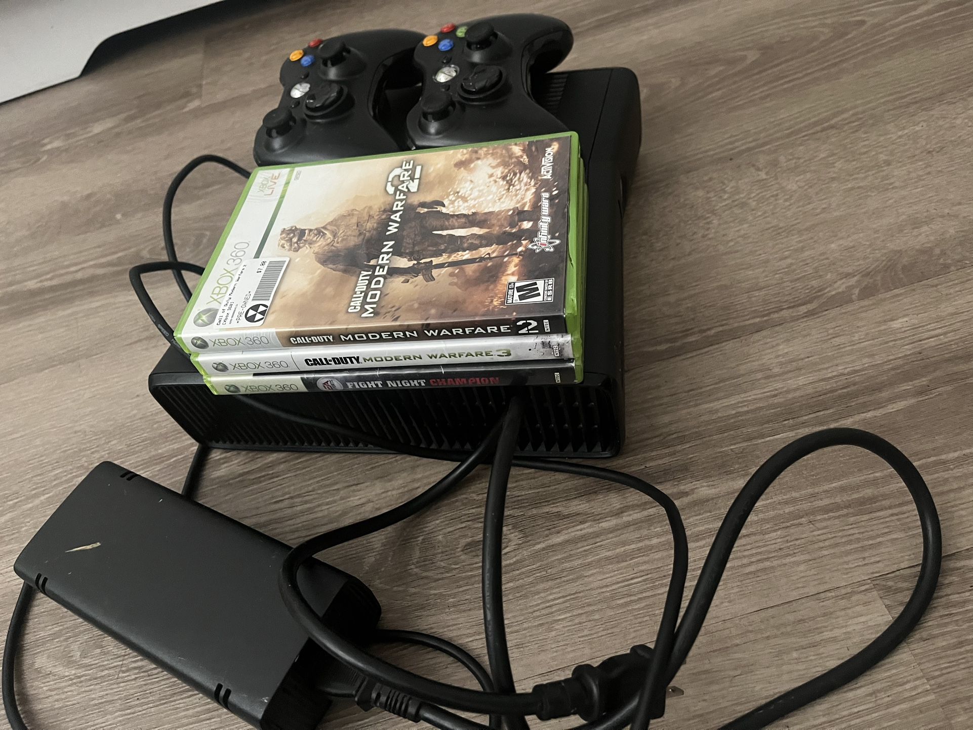 Xbox 360 with games and 2 controllers and cords 