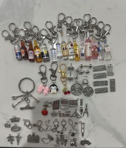 Key chains penguin, cherry, bow, beer, redbull, water, mechanic, bacardi, titos, nurse, teacher, gym