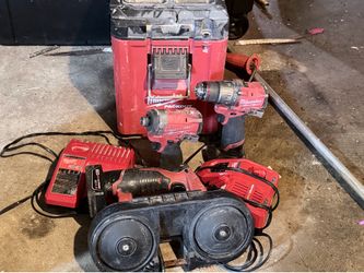 Milwaukee bandsaw ,two drills, two charger pack out box all included