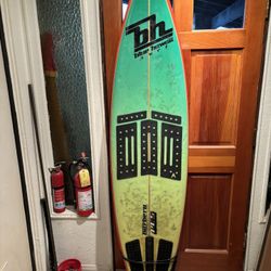 6’10” blue hawaii surf board & on a mission bag.