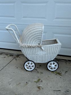 Antique wicker doll carriage