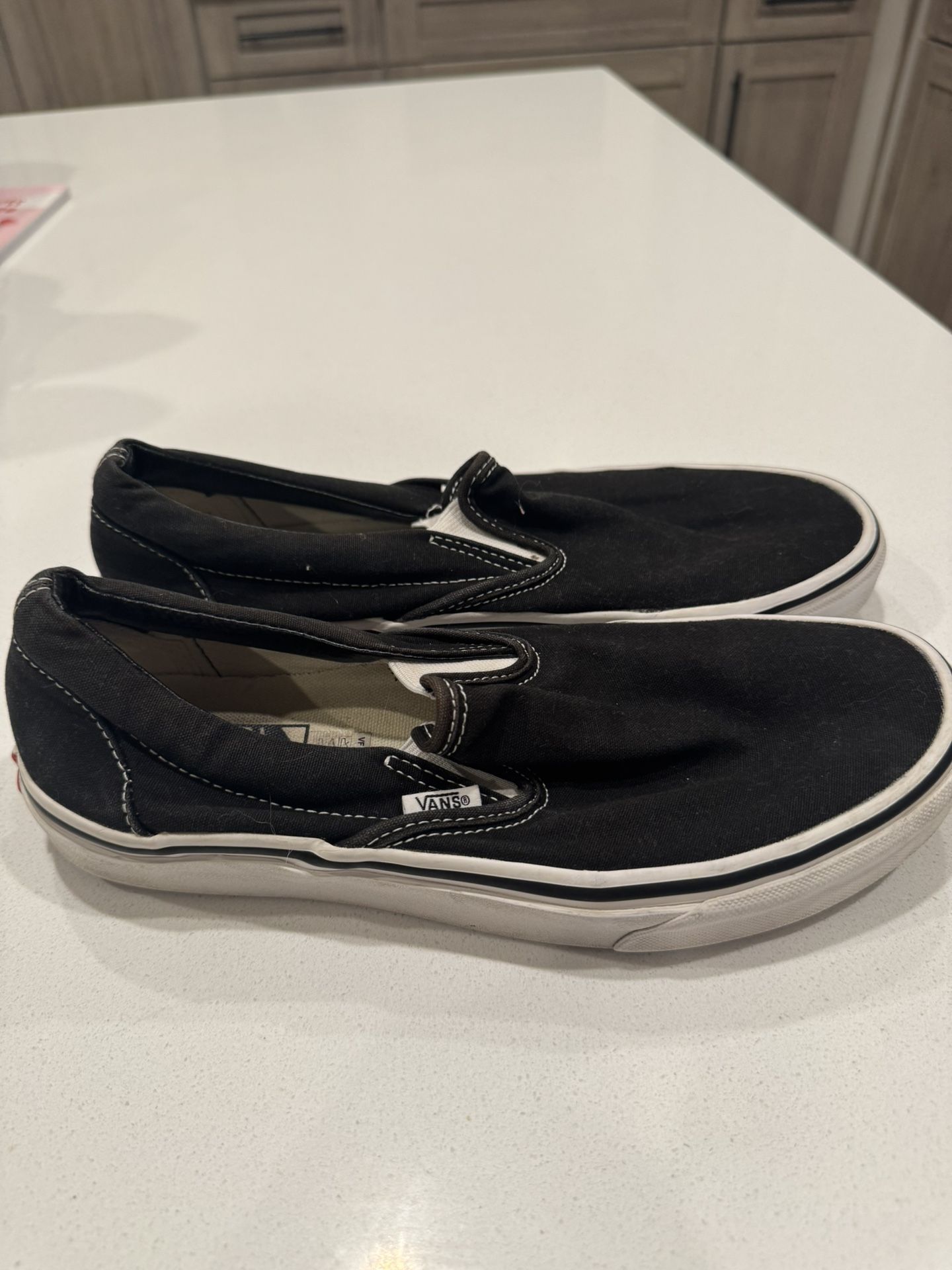 Vans Black Slip Ons