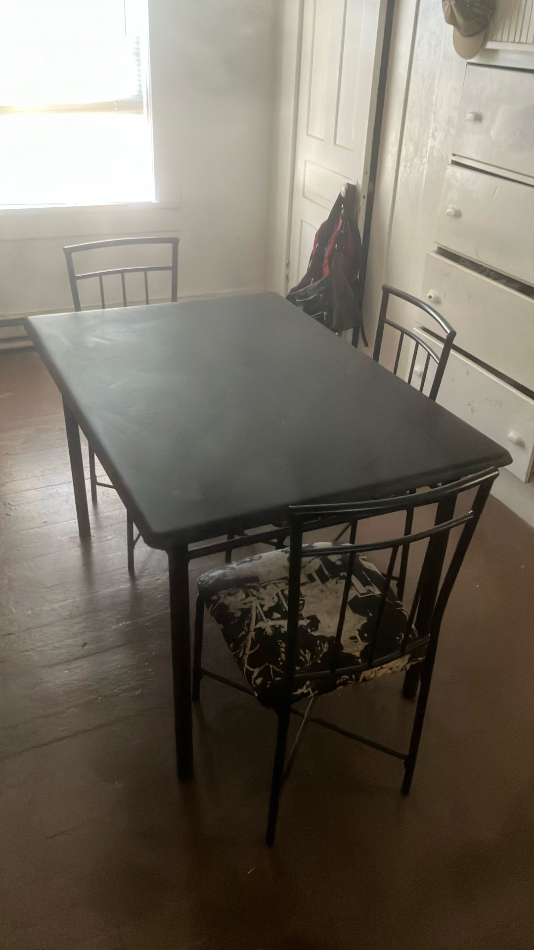 Table And Three Chairs