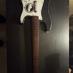 The Fender Stratocaster, often referred to as the Strat, is an electric guitar and the basis for Rock Band's signature guitar controller.
