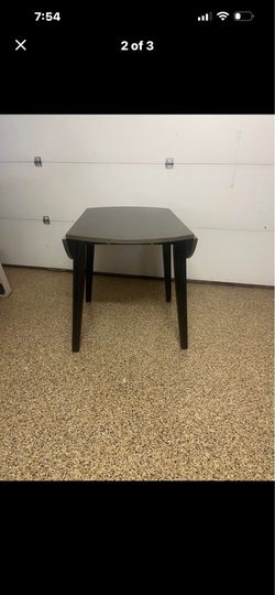 Drop-leaf table gray top black legs