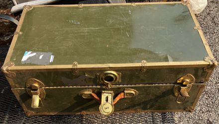 Metal trunk with key lock and removable storage tray.