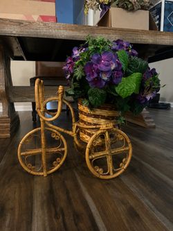 Faux floral arrangement with tricycle plant stand