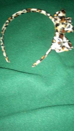 Small Leopard print headband with bow.