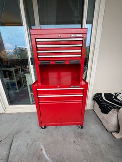 Red Craftsman toolbox on wheels