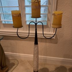 Wrought  iron floor standing candle holder features a whitewashed, spiral-carved wooden stem and three arms - 42” T