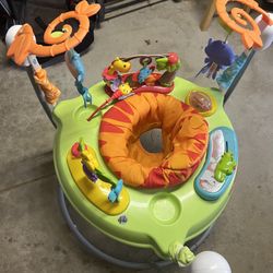 Fisher-Price Roarin' Rainforest Jumperoo infant activity center.  