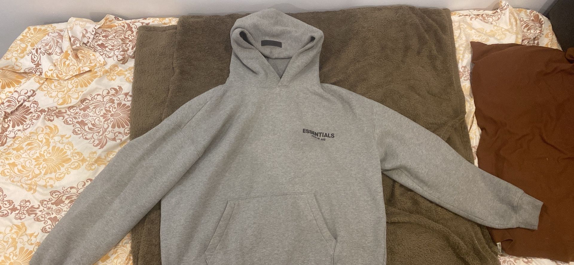 Size Large grey oatmeal essential hoodie good condition feels great on body