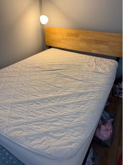 Queen sized bed frame, mattress and mattress topper