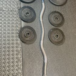 Standard Steel Curl Bar with Cast Iron Weight Plates pairs: 15#, & 4X 5 #. Total: 66 pounds