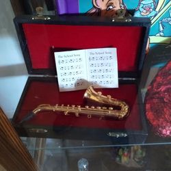 miniature saxophone in case