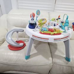 Fisher-Price Baby to Toddler Toy 2-In-1 Sit-To-Stand Activity Center with Music Lights and Spiral Ramp, Spin ‘N Play Safari