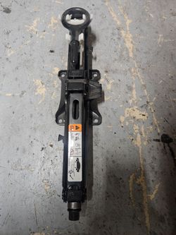 Basic jack from a sedan car. No tools just jack as in picture