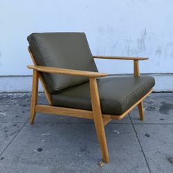 Mid century Blonde Oak and leather lounge chair.