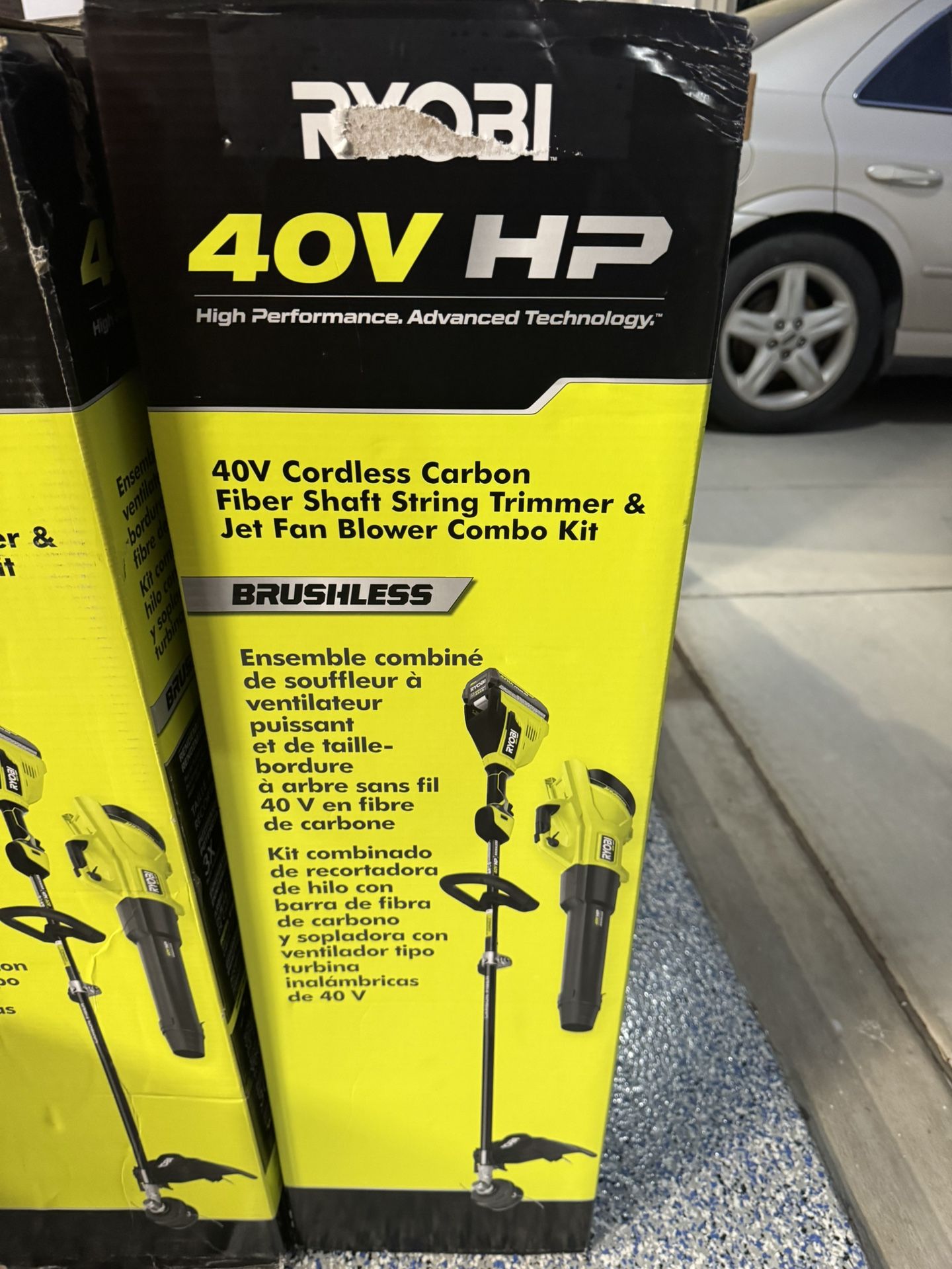 RYOBI 40V HP Brushless 600 CFM 155 MPH Cordless Leaf Blower and Carbon Fiber String Trimmer with 4.0 Ah Battery and Charger