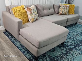Excellent condition, like new. Gray sectional sofa, 3 pieces, join together with hooks, removable double-sided covers, pet and smoke free, delivery av