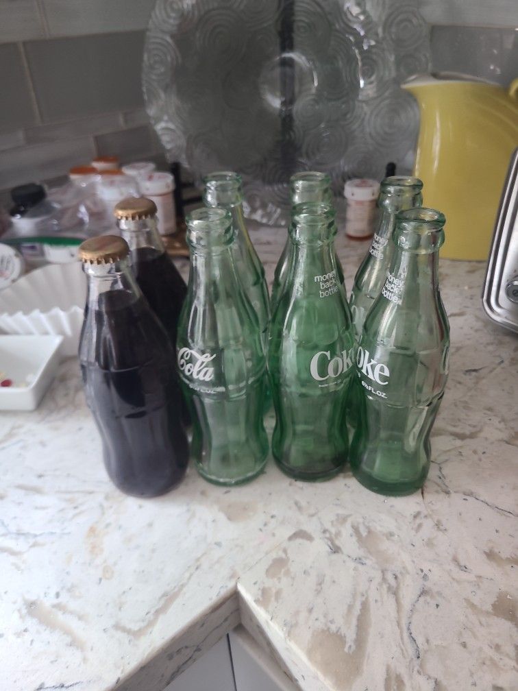 8 Vintage Coke Bottles , 2 Filled With Coke