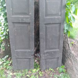 Pair of primitive hay barn shutters, with original hardware
