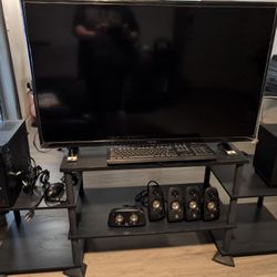Insignia Television W/ speaker setup/computer tower/ keyboard/mouse