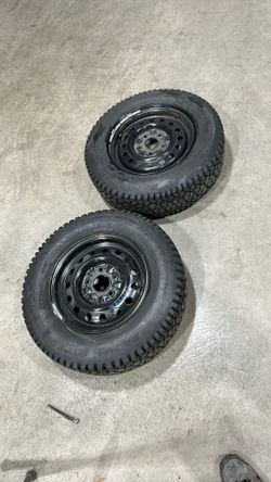 2 STUDDED SNOW TIRES WITH RIMS. 14 In WHEELS