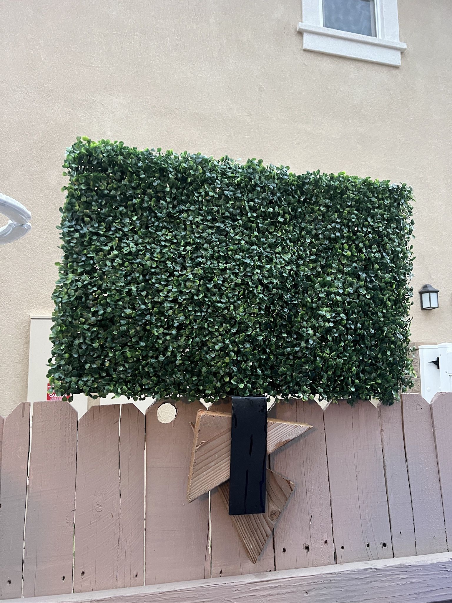4 pack artificial boxwood hedge panels, 20”H x 30”W x 3”thick, standing on the wall 4” thick