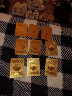 (9) Gold Pokemon cards..."Charizard V MAX card included..