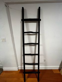 Black wooden decorative blanket ladder