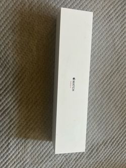 Apple Watch Series 3 with charger and wrist bands unlocked and ready to use