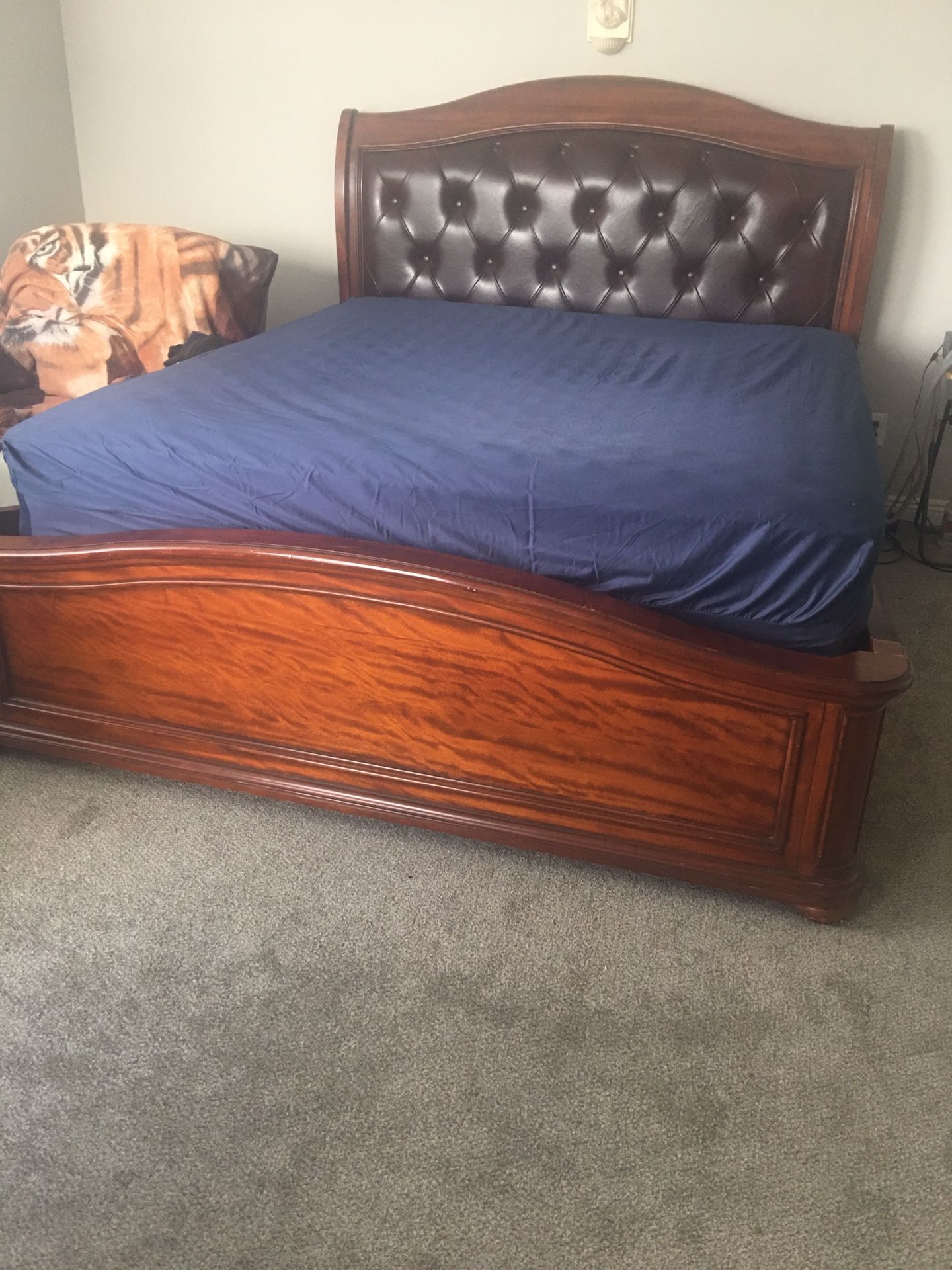 Mattress cal king. And wood frame. Solid