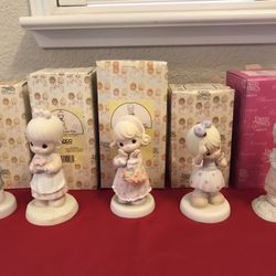 A group of 5 vintage Precious Moments figurines
