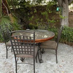 Used Wooden Table With Glass Cover & Includes 4 Chairs