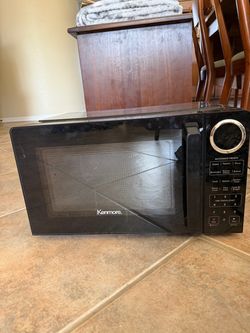 Kenmore black compact microwave oven. Perfect condition.